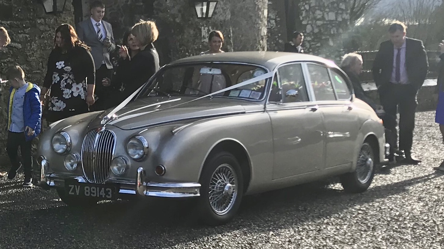 Our Golden Jaguar wedding car adds a sense of opulence to any wedding day