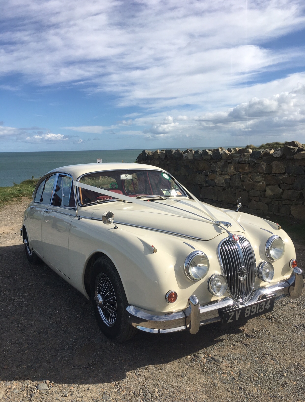  wedding car hire with our 1961 Jaguar in Old English White 